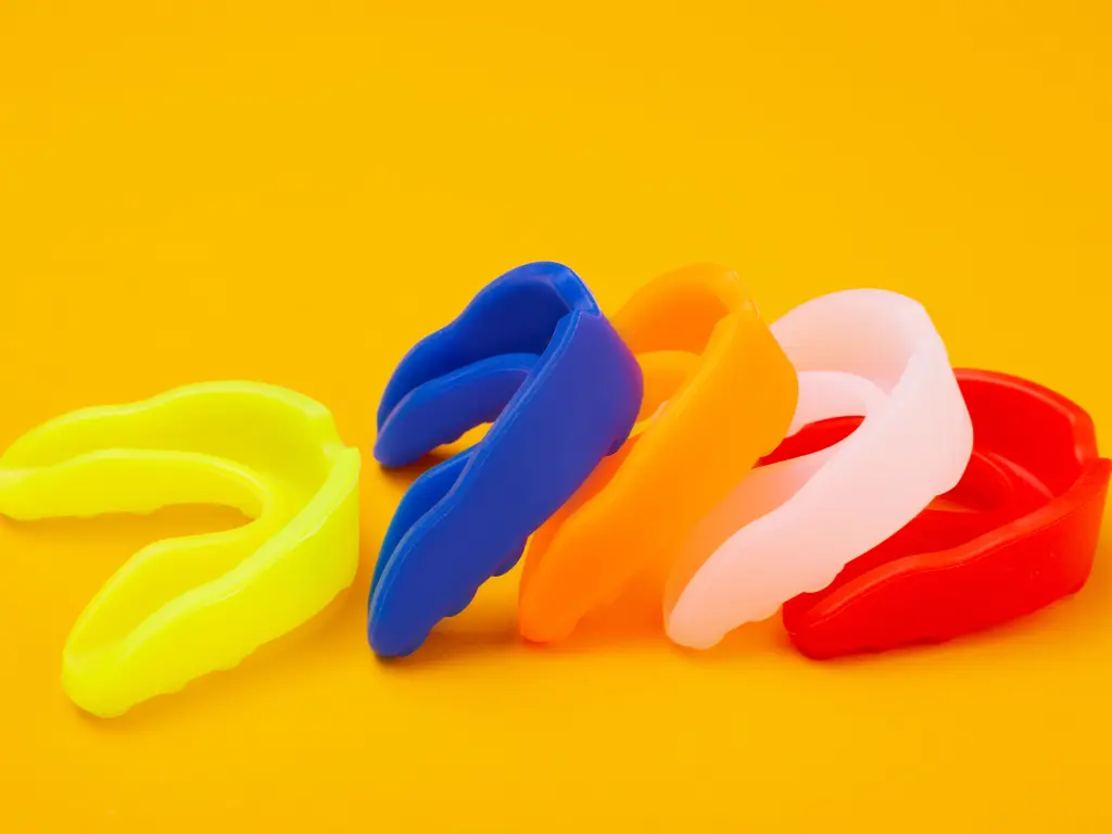 Mouth guards of different colors and styles